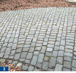 Dieselbe Fläche im öffentlichen Bereich in Gütersloh nach dem Einfegen von Gesteinsmehl in die Fugen.